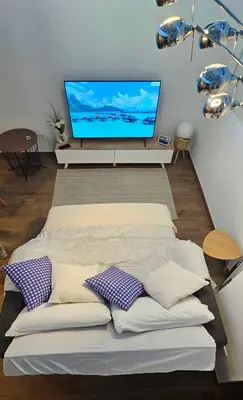 a loft bedroom with a bed and a staircase at Apartamento Ciudad de Las Ciencias - Apartamento Ciudad de Les Arts in Valencia