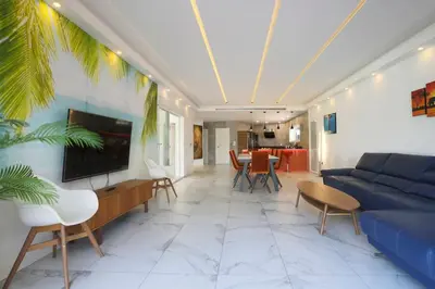 a living room with a blue couch and a tv at Fantasy Villa Valencia - Airport & Circuit Ricardo Tormo in Chiva