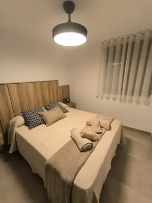 a bedroom with a large bed with pillows on it at Casa Otilia, Aventura y Relax in Buñol