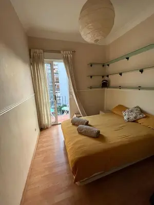 a bedroom with a bed with two pillows on it at Precioso apartamento al lado de la Ciudad de las Artes in Valencia