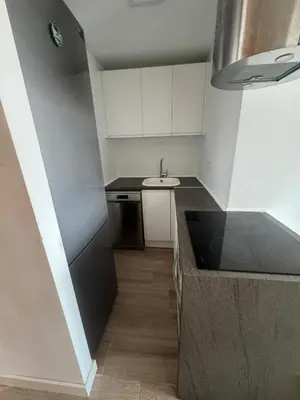 a small kitchen with a sink and a counter at Apto con encanto en primera línea de playa , Cullera in Cullera