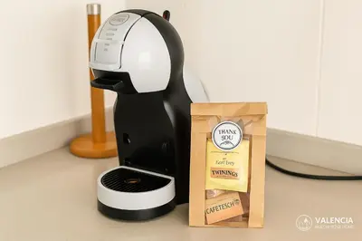 a black and white mixer next to a box at Valencia Beach Home 22 in Valencia