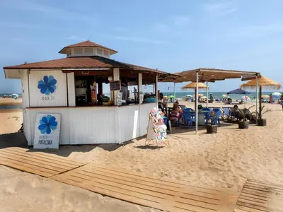a beach bar on the beach with people sitting at Valencia Beach Home 22 in Valencia
