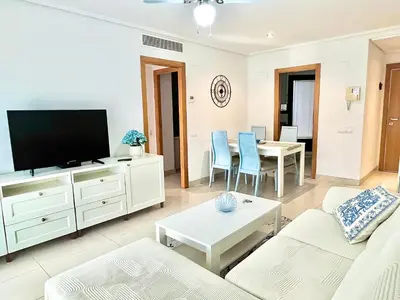 a living room with a couch and a tv at Valencia Beach Home 22 in Valencia