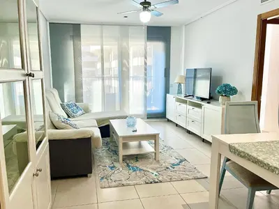 a living room with a couch and a tv at Valencia Beach Home 22 in Valencia