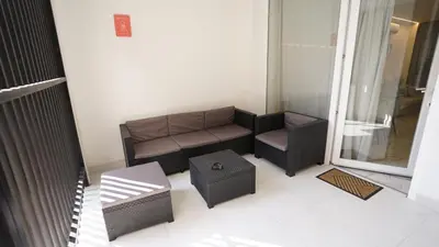a living room with a couch and a chair at Modern Loft in Patraix, Valencia - Near City Center in Valencia