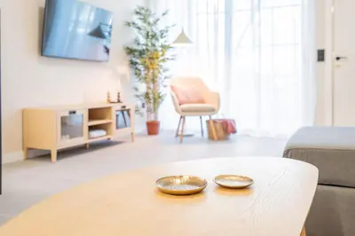 a living room with a table with two plates on it at Loft HomeValencia in Valencia