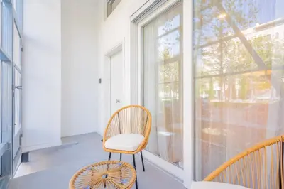 a room with a chair and a window at Loft HomeValencia in Valencia