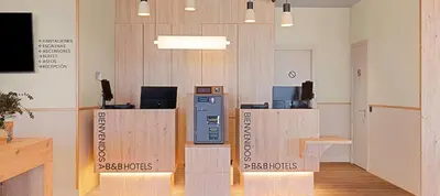 an office with a cash register and a pay phone at B&B HOTEL Valencia Alcàsser in Alcácer