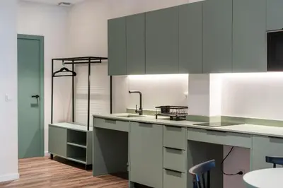 a kitchen with white cabinets and a sink at VLC HOST - Reina 168 in Valencia
