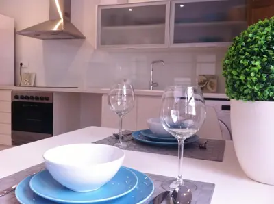 a kitchen with two wine glasses and a bowl on a counter at Superb Central Market Apt in Valencia