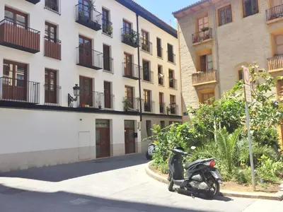 a motorcycle parked in front of a building at Superb Central Market Apt in Valencia