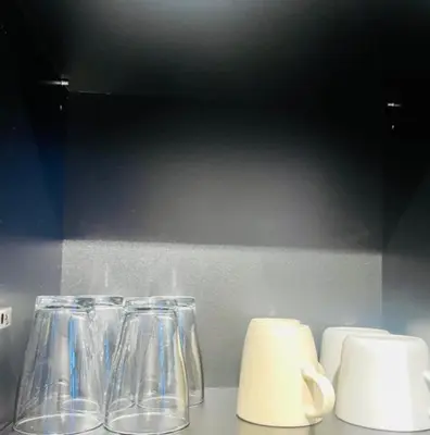two glass vases sitting on top of a counter at Apartahotel Espai Verd Benimaclet in Valencia