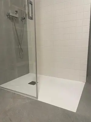 a shower stall with a glass door with a shower at Apartahotel Espai Verd Benimaclet in Valencia