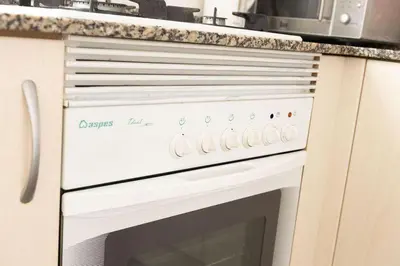 a white oven with a microwave on top of it at Habitación Cardenal 2 in Valencia