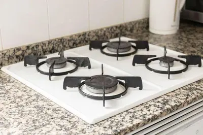 a stove top with four burners on a counter at Habitación Cardenal 5 in Valencia