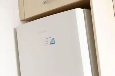 a white refrigerator with a box on top of it at Habitación Cardenal 5 in Valencia