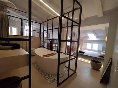 a bathroom with a bath tub in a room at Estudio Cama King in Valencia