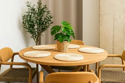 a wooden table with plates and plants on it at Formidable Apartments in Valencia