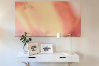 a white table with a lamp and a painting on the wall at Marques de Caro Rooms Luxury in Valencia