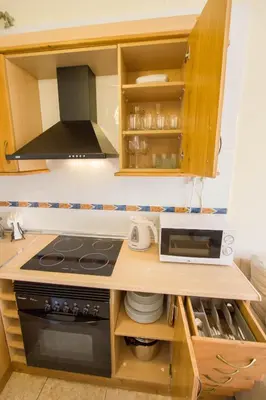 a kitchen with a stove and a microwave at Valencia central apartment in Valencia
