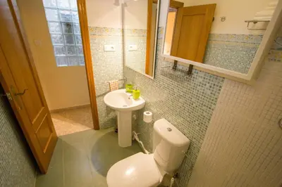a bathroom with a toilet and a sink at Valencia central apartment in Valencia
