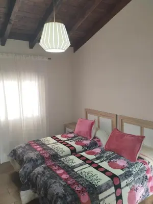 a bedroom with a bed with a quilt and pillows at Casa Bonaire in Chella