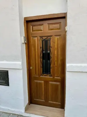 a wooden door in the side of a building at Casa típica Valenciana in Valencia