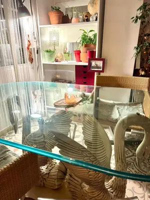 a glass table with two birds on top of it at Casa típica Valenciana in Valencia