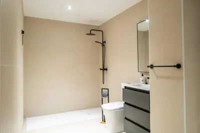 a bathroom with a shower and a toilet and a sink at Flats nou Mestalla in Valencia