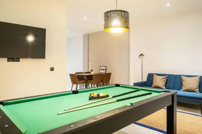 a living room with a pool table and a couch at Flats nou Mestalla in Valencia