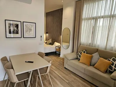 a living room with a couch and a table at HOB Miracle in Valencia