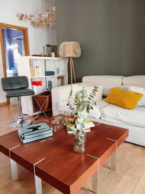a living room with a coffee table and a white couch at Cozy flat in old town in Valencia
