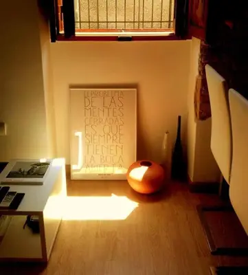a room with a painting and a computer mouse on the floor at Cozy flat in old town in Valencia