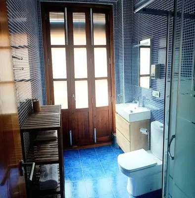 a bathroom with a toilet and a sink at Cozy flat in old town in Valencia