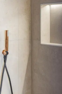 a shower with a glass door and a mirror at Suite Deluxe Valencia - Ciudad de las Artes in Valencia