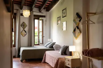 a bedroom with two beds and a window at Apartamentos Mercado Central in Valencia