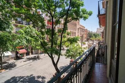 a view of a city street from a balcony at Apartamentos Mercado Central in Valencia