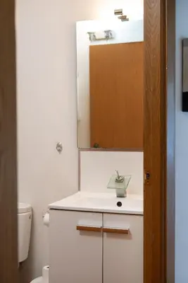 a bathroom with a sink and a mirror at Apartamentos Mercado Central in Valencia