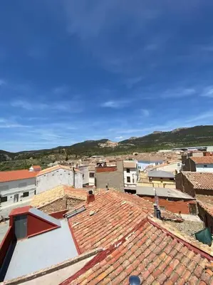 an overhead view of a city with roofs at Ático en el casco histórico con increibles vistas de montaña in Higueruelas