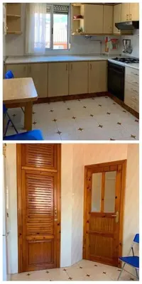 a kitchen with a table and a door in it at Ático en el casco histórico con increibles vistas de montaña in Higueruelas