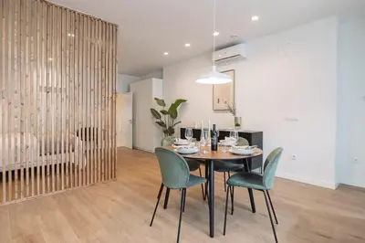 a dining room with a table and four chairs at SariStays Valencia Urban Chic Loft in Valencia