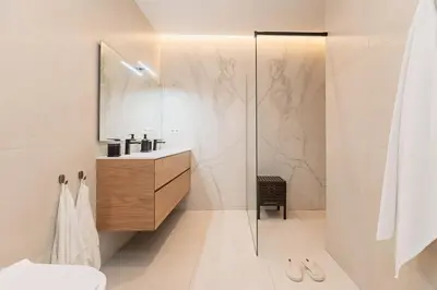 a bathroom with a shower and a sink and a mirror at SariStays Valencia Urban Chic Loft in Valencia