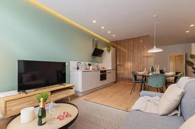 a living room with a couch and a television at SariStays Valencia Urban Chic Loft in Valencia