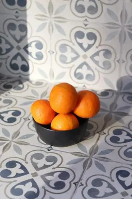 a pile of oranges in a bowl on a table at Stylish apartment near Old town & Turia park in Valencia