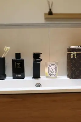 a shelf with some complimentary candles and a box at Stylish apartment near Old town & Turia park in Valencia