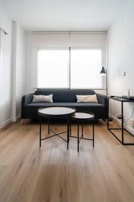 a living room with a couch and two tables at VLC HOST - Don Juan de Austria in Valencia