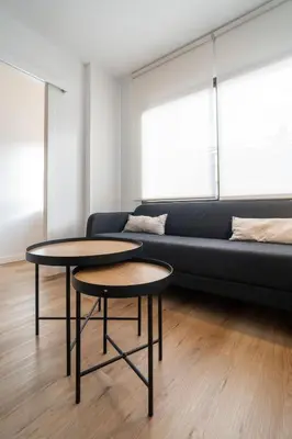 two tables in a living room with a couch at VLC HOST - Don Juan de Austria in Valencia