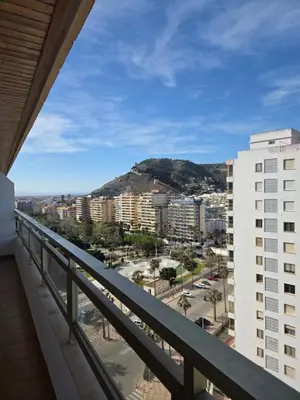 a hallway with an open door and a hallway with a hallwayngthngthngthngth at Apartamento frente a la playa in Cullera