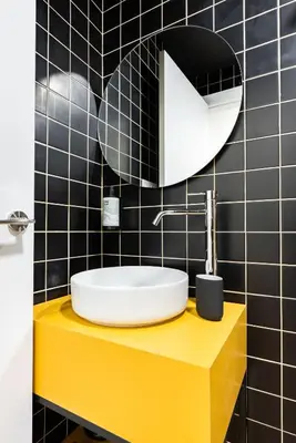 a bathroom with a sink and a mirror at Smartr Valencia Turia in Valencia